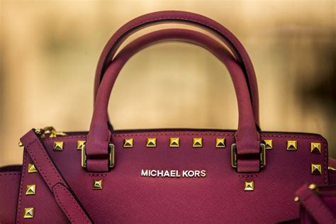 leather handbag by michael kors martin divisek bloomberg|It’s about to get a lot harder to get a discounted Coach or Michael .